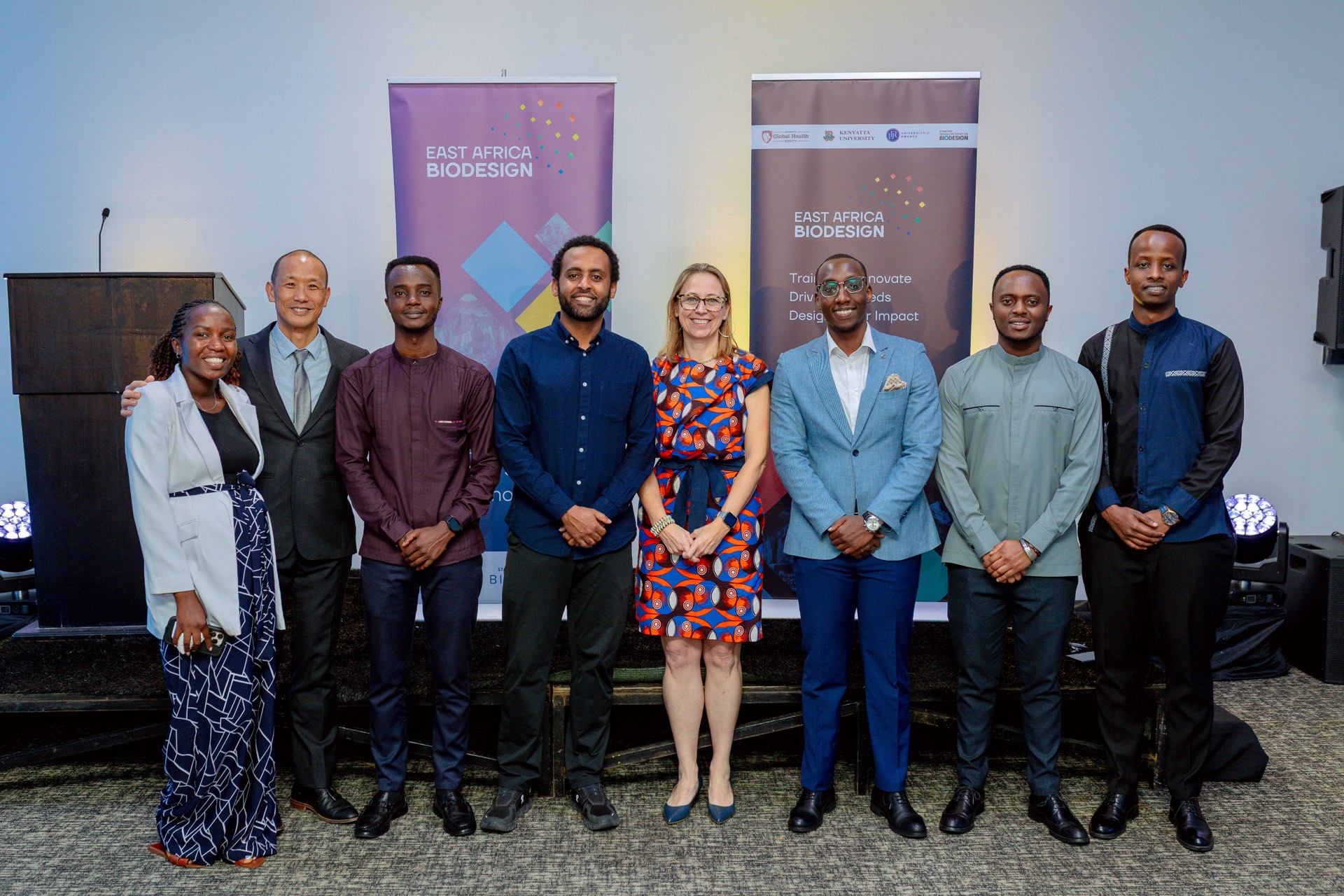 EAB fellows and faculty in front of the East Africa Biodesign banners